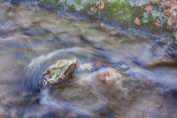 Rock in the middle of a stream