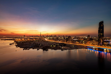Fototapeta premium A beautiful skyline view of Dubai as viewed from Dubai Festival City showing The Creek, Cusiness Bay Crossing and Garhoud Bridges.