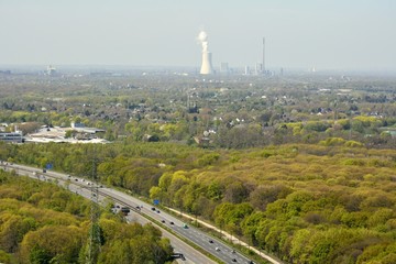 Obraz premium View over surroundings of Oberhausen, Germany, with plants in the distance.