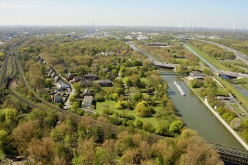 View over railroad tracks and Rhein-Herne-Kanal in Oberhausen, Germany.