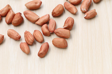 Focus fresh Peanuts on wooden background.