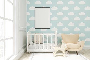 Close up of a child's room with cloud wallpaper on blue wall