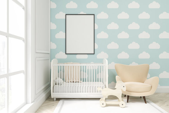 Close up of a child's room with cloud wallpaper on blue wall