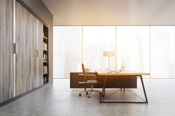 Side view of a CEO office with wooden doors and a bookcase, tone