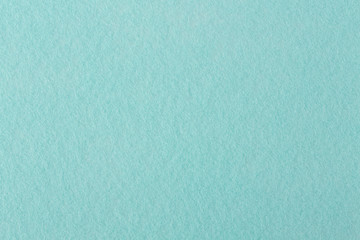 Texture of light blue felt.