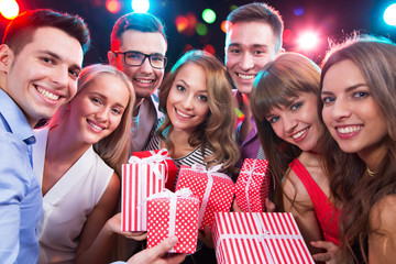 Group of young people with holiday gifts