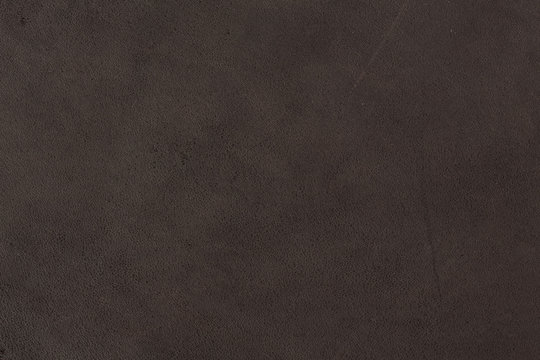 Dark brown leather texture, abstract background..