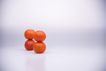 Fresh cherry tomatoes human shape isolated on white background cutout