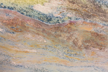 Fototapeta na wymiar Beige-yellow marble wall panel with decorative pattern.