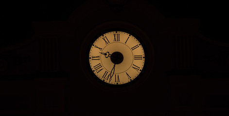 Obraz premium illuminated ancient clock on the building, night