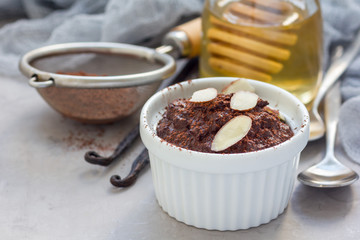 Healthy vegan homemade dessert with avocado, cocoa, vanilla, honey and almond milk, chocolate mousse, horizontal, copy space