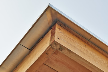 Roof under construction with wood frame and Zinc from behind