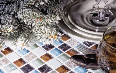 The plates on the Christmas table.