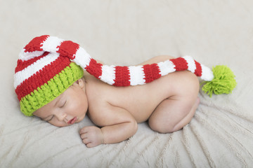 sleeping newborn baby in a wrap