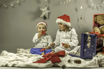Kids with Santa hat portrait. Christmas ornaments
