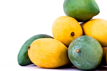 yellow ripe mango and fresh green mango on white background healthy fruit food isolated

