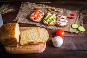 sandwiches on sacking on wooden background