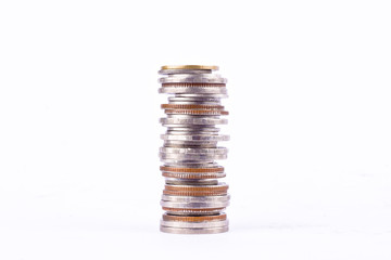 a pile of bath coins stacks on white background finance business isolated
