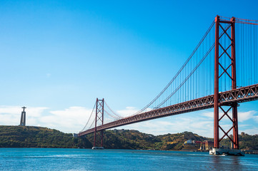 Fototapeta na wymiar Famous 25 de Abril bridge over Tagus in Lisbon, Portugal