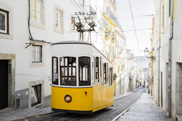 Fototapeta na wymiar Lisbon's Gloria funicular classified as a national monument opened 1885 located on the west side of the Avenida da Liberdade connects downtown with Bairro Alto.