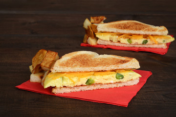 closeup omelette sandwich with fries
