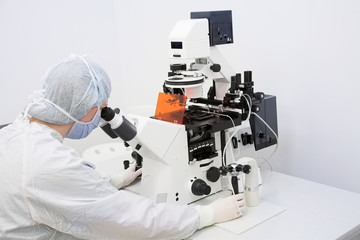 Woman looking in microscope