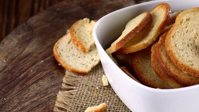Portion of rotating Bread Chips as not loopable 4K UHD footage