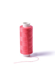 Colorful bobbin thread on white background