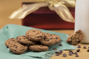 Cookies and Milk for Santa / Cookies and milk with Christmas decoration on a wooden background