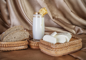 Fototapeta na wymiar organic milk in glass honey, almonds and goat cheese