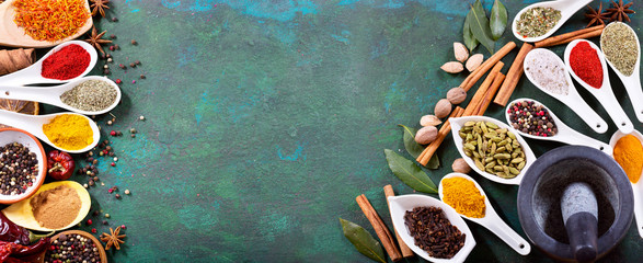 various spices on old green background