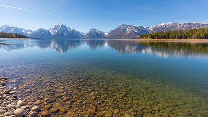 Beautiful snow-capped mountains reflected in the lake. Grand Teton National Park, Wyoming, USA