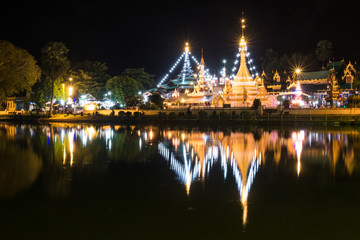 Temple light up at night with reflection