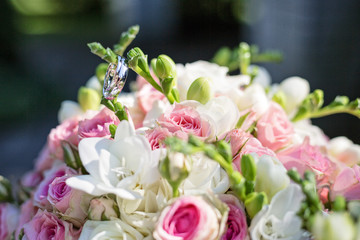 Wedding rings on wedding bouquet