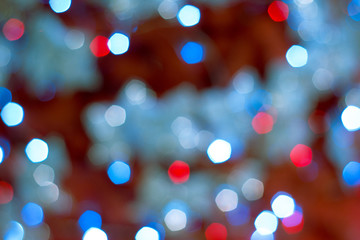 Colorful lights on red background. holiday bokeh. Abstract Christmas background