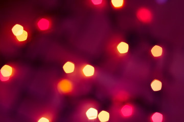 Colorful lights on red background. holiday bokeh. Abstract Christmas background