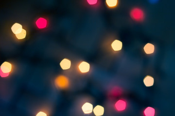 Colorful lights on red background. holiday bokeh. Abstract Christmas background