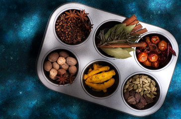 Various Spices and seasonings in the metallic form. top view