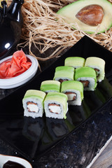 roll with avocado and salmon, tuna in a still life