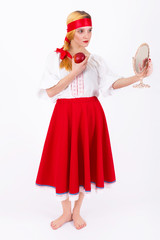 Beautiful young girl in traditional Russian clothes