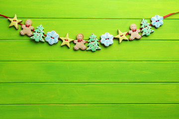 Christmas cookies on a green wooden table