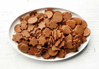 freshly baked gingerbreads on white plate