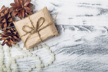 Christmas gift on grey wooden background