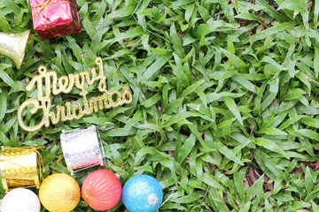 Christmas decoration on a green lawn.