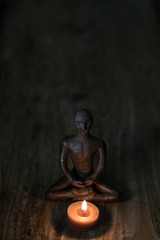 Fototapeta na wymiar Silhouette young monk statue praying practicing yoga and meditate. Vipassana concept. Yoga, health life concept.