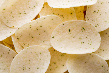 Close up potato chips on wood top view background.