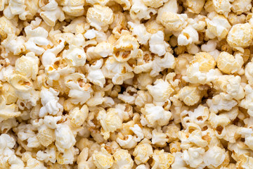 Popcorn background. Caramel sweet corn. Cinema snack.