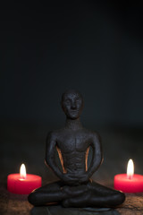 Silhouette young monk statue praying practicing yoga and meditate. Vipassana concept. Yoga, health life concept.