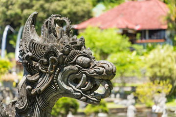 Fototapeta na wymiar Dragon statue in Water Palace of Tirta Gangga East Bali, Indonesia