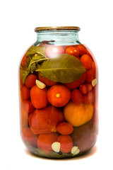 Canned vegetables in glass jars isolated on white background

